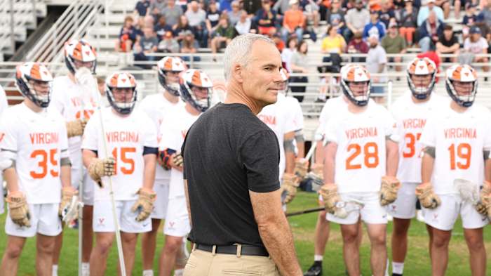Virginia men's lacrosse head coach Lars Tiffany stands before his team during the Virginia men's lacrosse game against Notre Dame at Klockner Stadium.